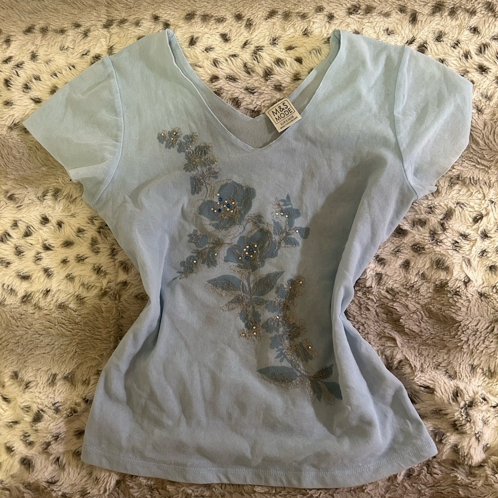blue top with floral details
